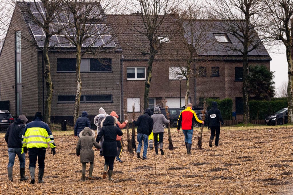 People walking with trees at the new DHL forest